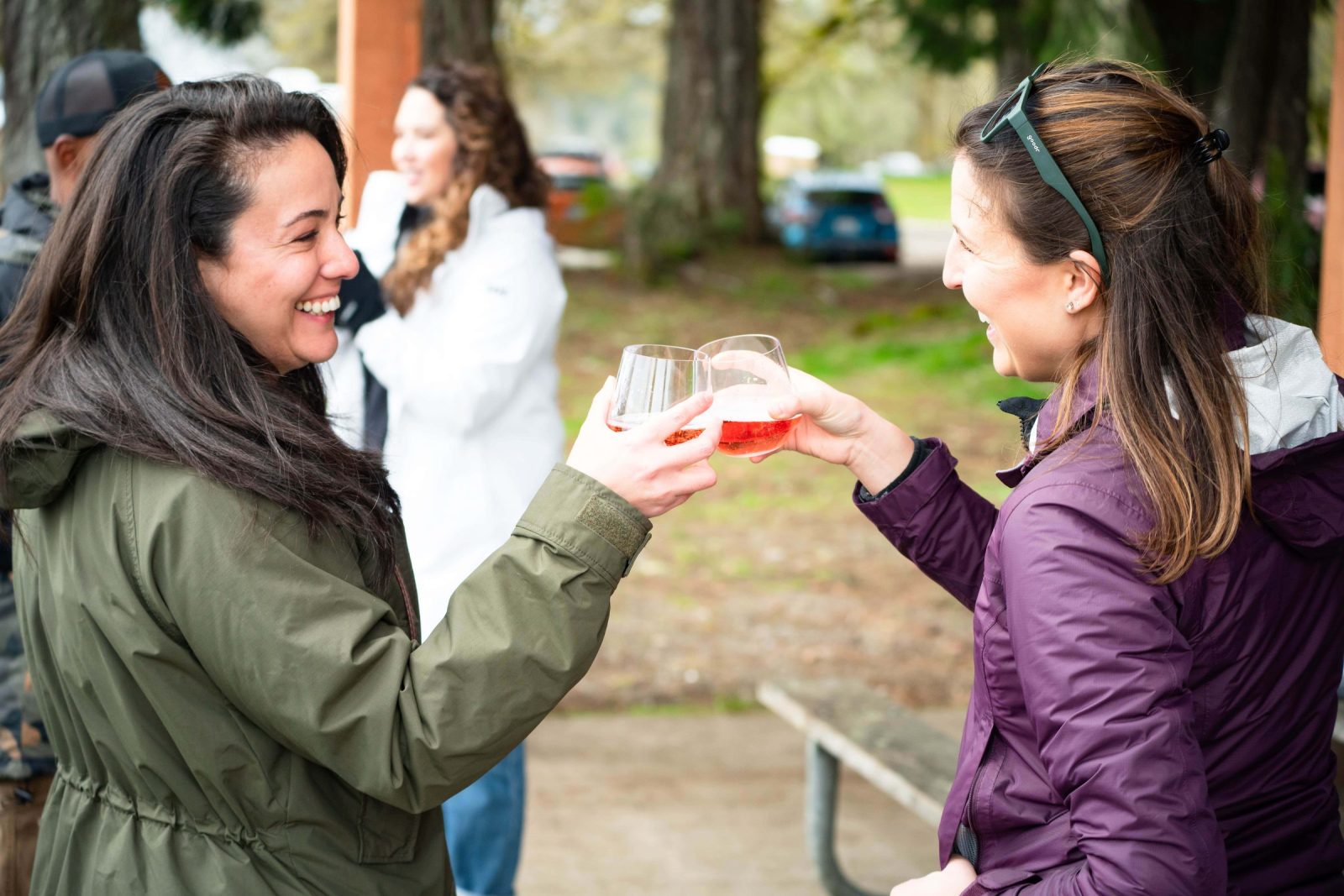Guests toast with drinks at a private foraging event